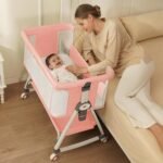 Pink Baby Bassinet with 6 Adjustable Heights and Storage Basket